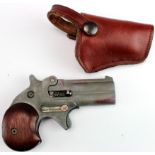 Blank firing, top venting Derringer twin o/u barrels 3", calibre .22 Blank. Sheath trigger, wooden