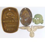 German SS field found skull, an eagle cap badge and 2x Gestapo / SS ID tags, Third Reich