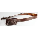 Hussars brown leather cross belt pouch and whistle, repair noted. Sold as seen