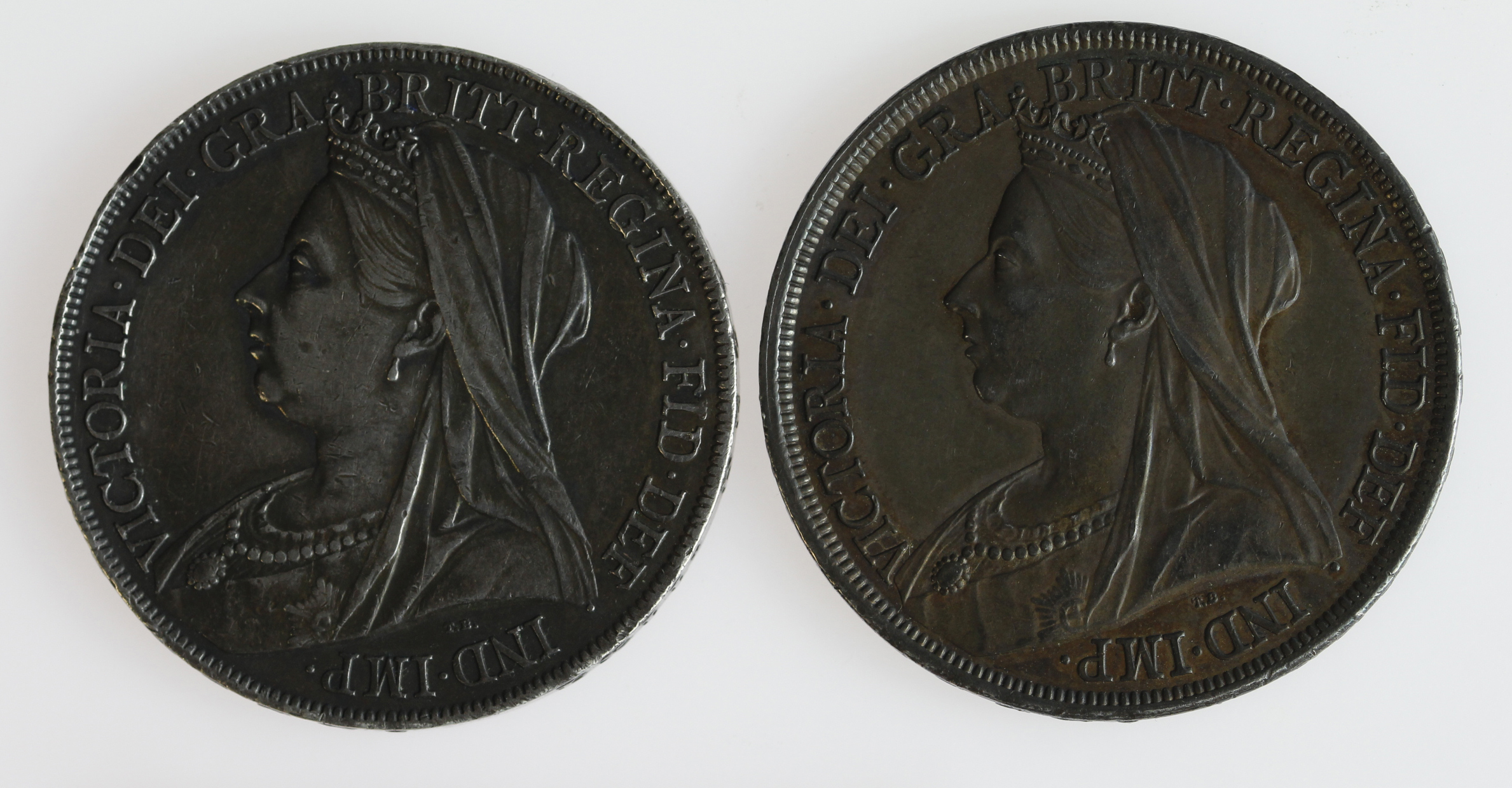 Crowns (2): 1893 LVI toned aEF, light scratch, and 1899 LXII toned GVF, edge nicks.