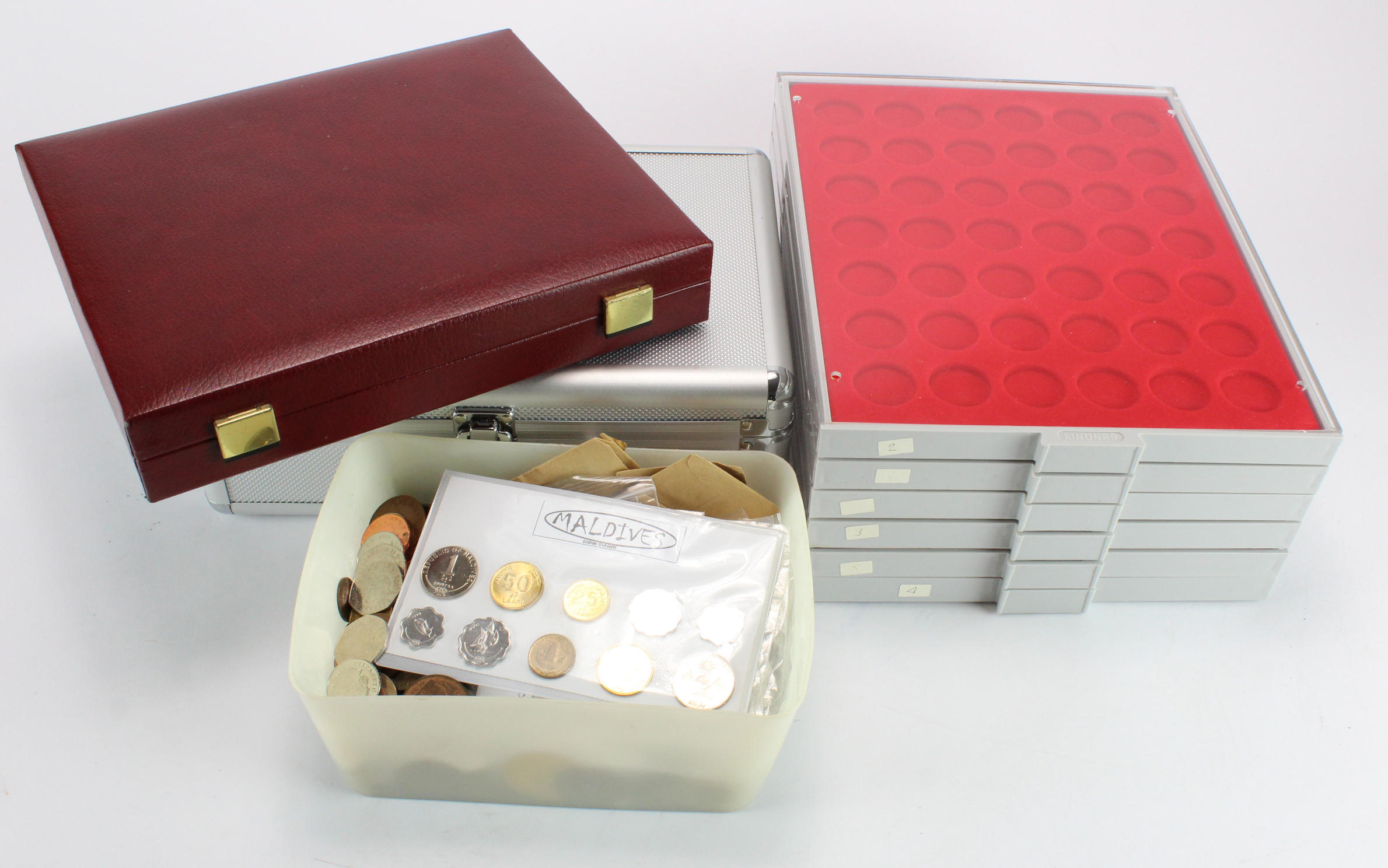 World Coins & Accessories: 6x Lindner trays, 3 to 3.5KG mixed world coins, a Westminster case, and a