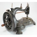 Sewing Machine. A cast iron sewing machine (possibly by Jones), height 25cm, length 37cm approx. (
