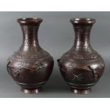 Vases. Two large bronze (?) vases with bat and bird decoration, no bases, height 39cm, diameter 24cm