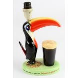 Guinness advertising toucan lamp featuring a toucan with beak protruding over a pint of Guinness.