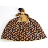 Norah Wellings island doll tea cosy.