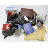 Cameras and equipment. A box containing cameras, lens, flashes, etc., makers include Miranda,