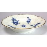 Nantgarw porcelain dish with embossed borders, with blue floral decoration & gilt rim, impressed