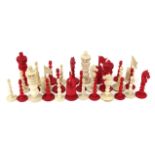 An Anglo-Indian, (possibly vizagapatam), carved ivory (natural) and horn (red stained), chess set,