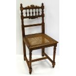 Wicker seated chair with carved decoration, height 93.5cm, seat diameter 53cm approx. (buyer