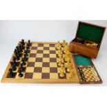 Chess interest. Two complete sets of Staunton style chess pieces, together with a cased Chess set by