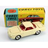 Corgi Toys, no. 239 'Volkswagen 1500 Karmann Ghia' (cream), with one suitcase, contained in original