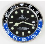 Advertising Wall Clock. Black & blue (Batman) 'Rolex' style advertising wall clock, black dial reads