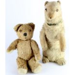 Two early to mid 20th century teddy bears, one depicting a polar bear (?), height 43cm approx., well