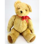 Teddy Bear. A large wind up musical teddy bear by Pedigree, length 77cm approx. (working at time