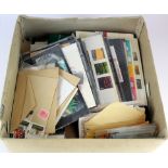 GB - box with an accumulation of UM decimal stamps, loose material stuffed into envelopes, Pres