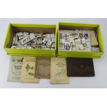 Banana box containing cigarette cards which appear to be mainly sorted into sets, near sets, or part