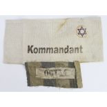 German Jewish ghetto arm band with part of cloth with the no 06734 stamped on.