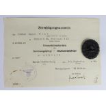 German Wound badge in black with award document to Packer August Menz in Berlin N65 Triftstr. 911.