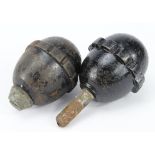 WW1 German egg grenades, one with fuse the other with filling plug, deactivated.