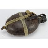 German 1942 Dated Africa Corps Husk Covered Water Bottle and Pannier. The Bakelite lid has a piece