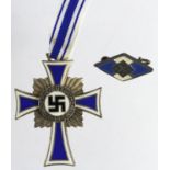 German Nazi Mothers cross silver award and Hitler youth pin.