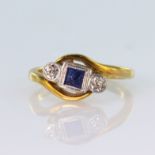 18ct yellow gold and platinum sapphire and diamond three stone ring in crossover design, total