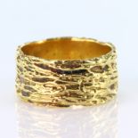 18ct yellow gold heavily textured 9mm wide band ring, finger size N, weight 8.6g