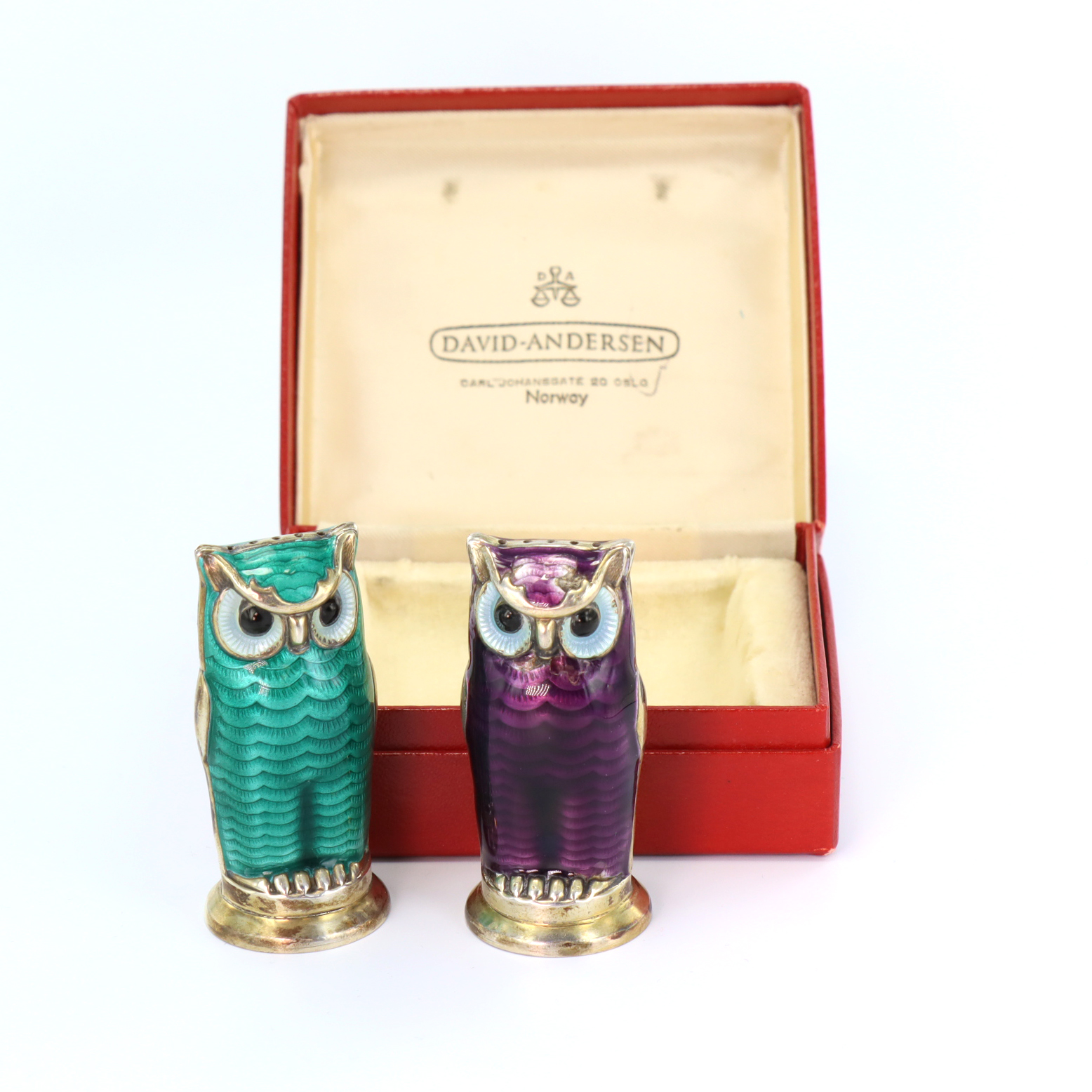 Boxed pair of Norwegian silver-gilt and enamel novelty owl pepper pots by David Andersen, with green