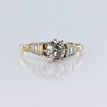 18ct yellow gold and platinum solitaire ring set with a round brilliant cut diamond weighing approx.