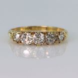 18ct yellow gold carved head ring set with five graduated old cut diamonds, centre diamond approx.