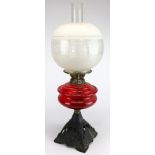 Oil Lamp. An iron based oil lamp, circa late Victorian, with inner glass tube & frosted shade, total