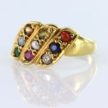 18ct yellow gold ring with three diagonal panels, each set with three gemstones comprising,