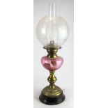 Oil Lamp. A brass based oil lamp, circa late Victorian, with inner glass tube & frosted glass shade,