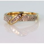 9ct yellow gold band ring set with seven baguette cut diamonds in a diagonal channel setting, with