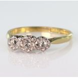 18ct yellow gold and platinum ring set with three graduated round old cut diamond with a total