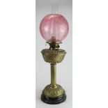 Oil Lamp. A brass based oil lamp, circa late Victorian, with inner glass tube & frosted /