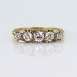 18ct yellow gold carved head ring set with five graduated old cut diamonds, centre diamond approx.