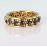 18ct yellow gold full eternity ring set with sixteen marquise shaped sapphires and sixteen round