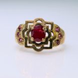 9ct yellow gold dress ring set with a central oval ruby measuring approx. 6mm x 5mm and