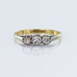 18ct yellow gold and platinum graduated three stone ring, set with a central round brilliant cut