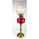 Oil Lamp. A brass based oil lamp, circa late Victorian, with inner glass tube & frosted /