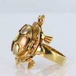 Tests as 14ct yellow gold ring in the shape of a turtle with articulated leags, tail and head, shell