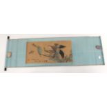 Japanese scroll painting in ink and colour. Depicting a hawk in flight attack. Blue patterned