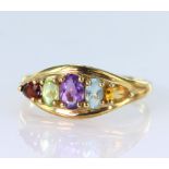 9ct yellow gold multi gemstone dress ring with a central oval amethyst measuring approx. 6mm x