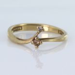 9ct yellow gold band ring set with two round diamonds with a total diamond weight of approx. 0.04ct,