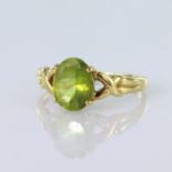 18ct yellow gold ring set with an oval peridot measuring approx. 9.5mm x 7.5mm, finger size Q,