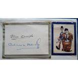 Autographs, a signed piece of card by Stan Laurel & Oliver Hardy,(2" x 3"), mounted on album page