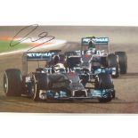 Motor Racing autograph, Lewis Hamilton, 12" x 8" colour photograph showing Hamilton in race action