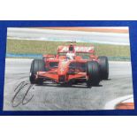 Motor Racing Autograph, Kimi Raikkonen, a colour 12" x 8" photograph showing action shot signed in