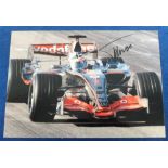 Motor Racing Autograph, Fernando Alonso, a colour 12" x 8" photograph showing race action, signed in